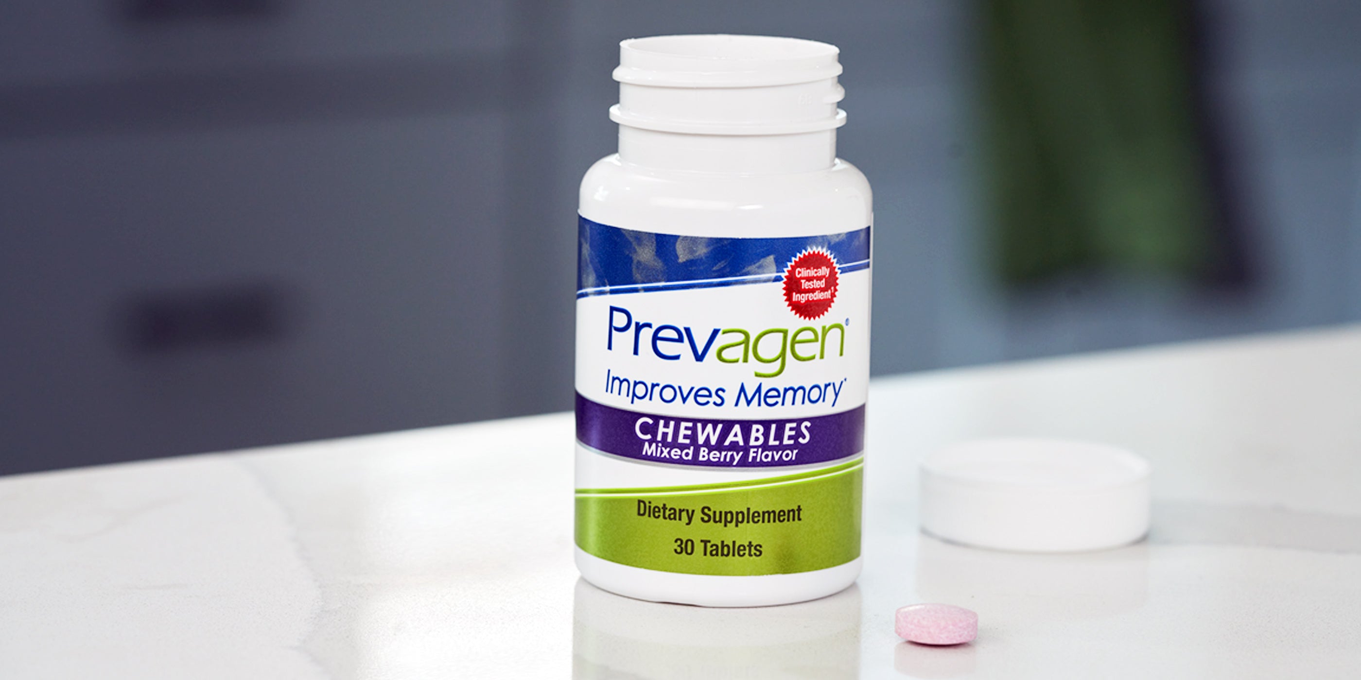 Bottle of Prevagen mixed berry flavor chewables on kitchen counter