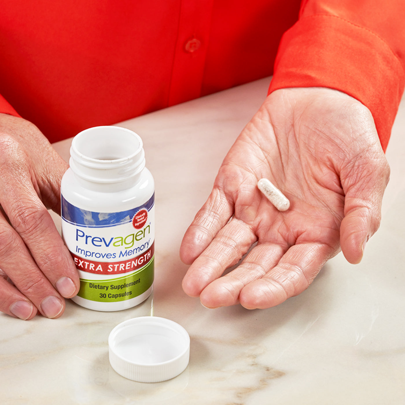 Capsule in hand from Prevagen extra strength 30 day supply bottle