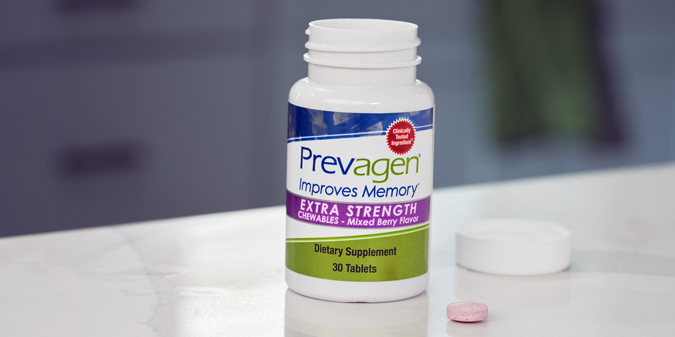Bottle of Prevagen extra Strength Mixed Berry Chewables on kitchen counter